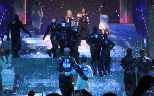 Madonna and Quavo sing “Future” at the Eurovision Song Contest as two dancers walk arm-in-arm with Israeli and Palestinian flags on their backs, May 18, 2019 (YouTube screenshot)