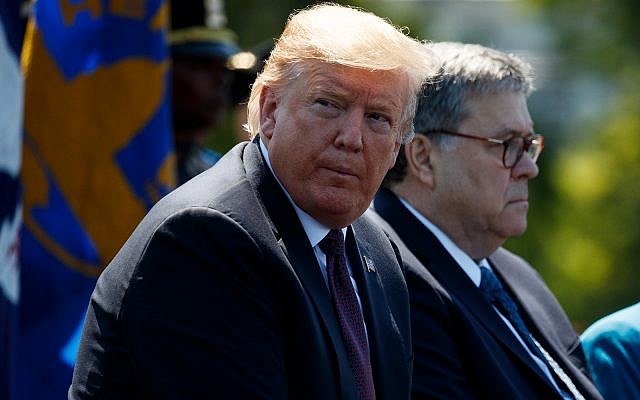 US President Donald Trump sits with Attorney General William Barr during the 38th Annual National Peace Officers' Memorial Service at the US Capitol, May 15, 2019, in Washington. (AP Photo/Evan Vucci)