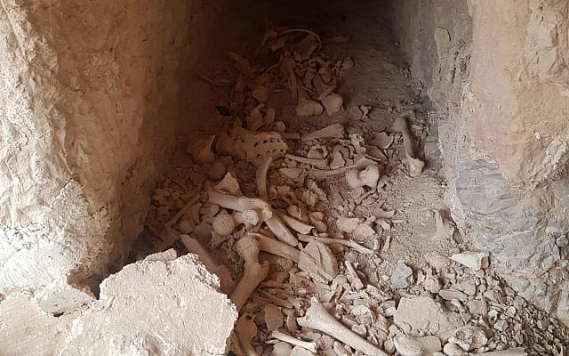 Remains of believed Second Temple-era Jews, exposed when their tombs near Jericho were damaged, are re-interred at the nearby Kfar Adumim settlement on May 21, 2019. (Courtesy Regavim)