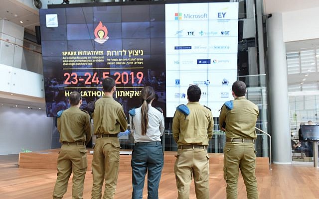 IDF soldiers from the C4I and Cyber Defense Directorate took part in the  Spark Hackathon, held in May 23-24, 2019, to preserve the memory of the Holocaust and increase the quality of life of the survivors (IDF spokesperson's unit)