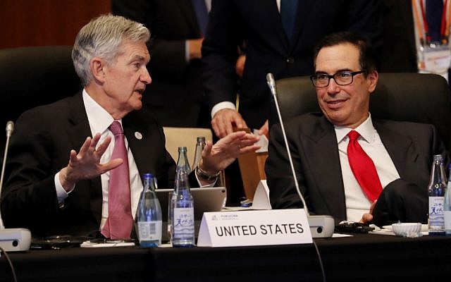 Federal Reserve Chairman Jerome Powell (L) talks with US Treasury Secretary Steven Mnuchin during the G20 finance ministers and central bank governors meeting in Fukuoka on June 8, 2019. (KIM KYUNG-HOON / POOL / AFP)
