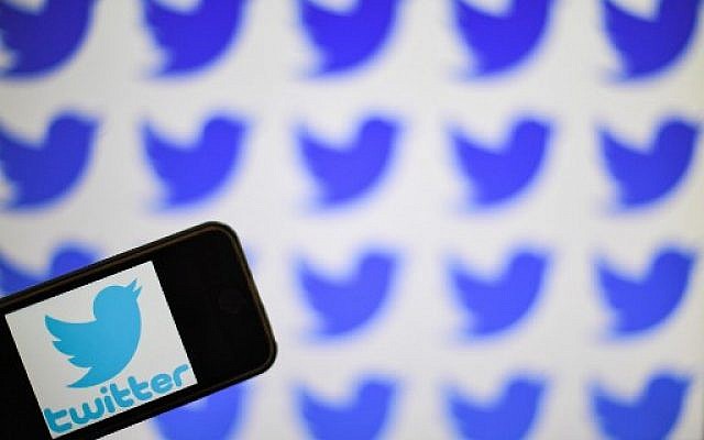 Illustrative: The logo of US social network company Twitter displayed on the screen of a smartphone, May 2, 2019. (Loic Venance / AFP)