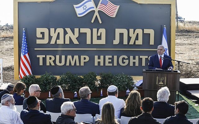 Prime Minister Benjamin Netanyahu gives a speech before the newly-unveiled sign for the new settlement of 'Ramat Trump', or 'Trump Heights' in English, named after the incumbent US President during an official ceremony in the Golan Heights on June 16, 2019. (Jalaa MAREY / AFP)