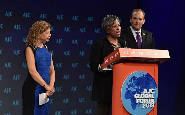 Rep. Brenda Lawrence, D-Mich., flanked by Rep. Debbie Wasserman Schultz, D-Fla., and Rep. Lee Zeldin, R-NY, launches the black-Jewish caucus at the annual American Jewish Committee Global Forum in Washington DC, on June 3, 2019. (AJC via JTA)