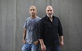 In this May 30, 2019 photo, co-creators of Israel's hit TV show 'Fauda' Avi Issacharoff (left), who is also The Times of Israel's Arab affairs analyst, and Lior Raz pose for a photo in Tel Aviv, Israel. (AP Photo/Oded Balilty)