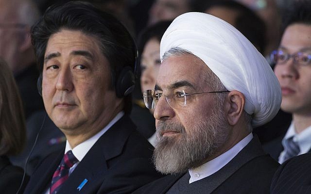 Illustrative: In this Jan. 22, 2014 file photo, Japanese Prime Minister Shinzo Abe, left, and Iranian President Hassan Rouhani, attend a session of the World Economic Forum in Davos, Switzerland. (AP Photo/Michel Euler, File)