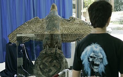 A Uruguayan resident observes the eagle on display from the German battleship Graf Spee in Montevideo, Uruguay, Feb. 14, 2006 (AP Photo/Marcelo Hernandez) (AP Photo/Marcelo Hernandez).