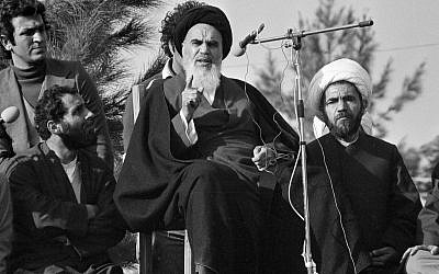 The Ayatollah Khomeini speaks to followers at Behesht Zahra Cemetery after his arrival in Tehran, Iran, ending 14 years of exile, February 1 1979. (AP Photo/FY)