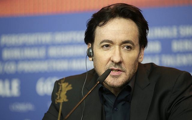 Actor John Cusack responds, during a press conference for the film 'Chi-Raq", at the 2016 Berlinale Film Festival in Berlin, Tuesday, Feb. 16, 2016. (AP Photo/Michael Sohn)