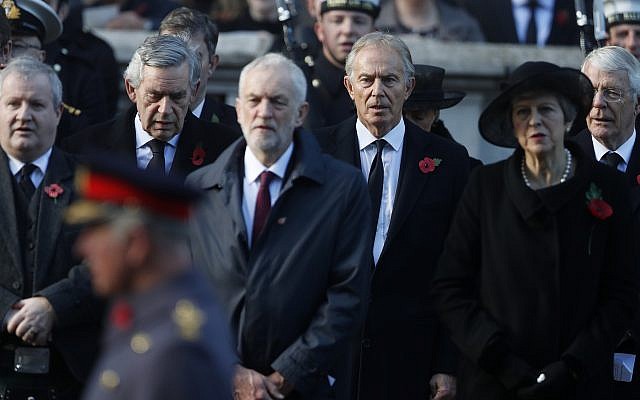 Britain's Prime Minister Theresa May, right, Former Prime Minister Tony Blair, center right,  Labour Party leader Jeremy Corbyn, center, and former prime minister Gordon Brown, rear left, attend the Remembrance Sunday ceremony at the Cenotaph in London, Sunday, Nov. 11, 2018. . (AP Photo/Alastair Grant)