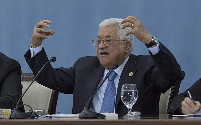 Palestinian President Mahmoud Abbas talks to reporters at the Palestinian Authority headquarters, in the West Bank city of Ramallah on June. 23, 2019. (AP/Nasser Nasser)