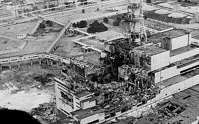 An aerial view of the Chernobyl nuclear power plant, the site of the world's worst nuclear accident, is seen in April 1986, made two to three days after the explosion in Chernobyl, Ukraine. In front of the chimney is the destroyed 4th reactor. (AP Photo)