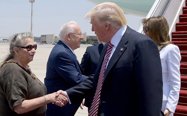 US President Donald Trump (R) shakes hands with President Reuven Rivlin's wife Nechama as he arrives at Ben Gurion Airport on May 22, 2017, for his first official visit to Israel since becoming US president. (Avi Ohayon/GPO)