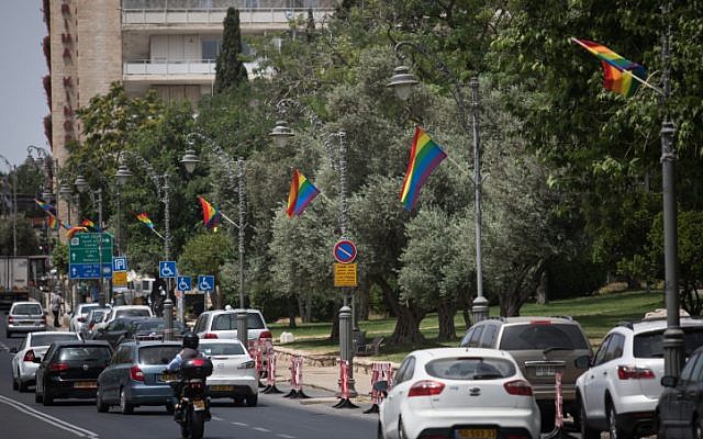 Pride rainbow flags hang on poles on Agron street in central Jerusalem on  June 4, 2019, ahead of the Jerusalem Pride Parade scheduled for June 6 that year (Hadas Parush/Flash90)
