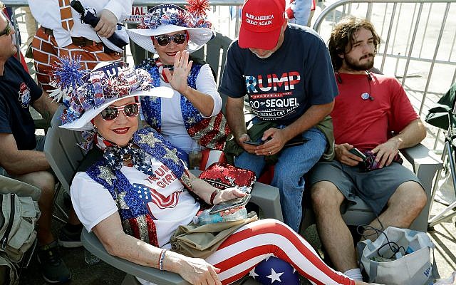 Supporters of US President Donald Trump wait in line hours before the arena doors open for a campaign rally in Orlando, Florida, June 18, 2019. (AP Photo/John Raoux)