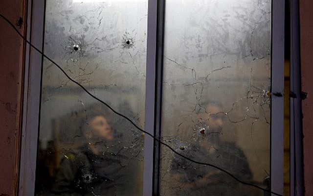 Bullet holes at the Palestinian Authority security apparatus headquarters in Nablus, a result of an accidental firefight between IDF troops and PA security personnel, June 11, 2019. (JAAFAR ASHTIYEH / AFP)