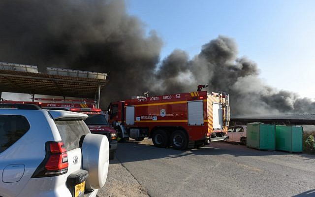 Firefighters work to extinguish a blaze caused by an incendiary device from the Gaza Strip in southern Israel on June 27, 2019. (Fire and Rescue Services)