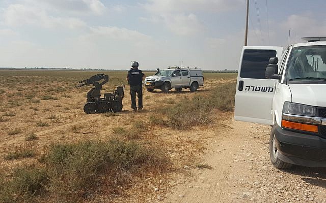 Police sappers deal with a suspected explosive device found in a field in the Eshkol Regional Council on June 28, 2019. (Eshkol Regional Council)