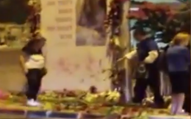 Man seen vandalizing a memorial to Shira Banki, the 16-year-old stabbed to death at the 2016 Jerusalem Pride Parade (Screen grab via Channel 13 news)