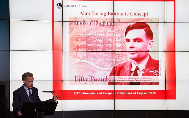 Mark Carney, governor of the Bank of England, speaks in front of the concept design for the new Bank of England 50 pound banknote, featuring mathematician and scientist Alan Turing, during the presentation at the Science and Industry Museum in Manchester, north-west England on July 15, 2019. (OLI SCARFF / AFP)