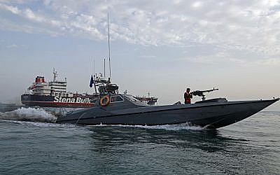 A picture taken on July 21, 2019, shows Iranian Revolutionary Guards patrolling around the British-flagged tanker Stena Impero as it's anchored off the Iranian port city of Bandar Abbas. (Hasan Shirvani / MIZAN NEWS AGENCY / AFP)