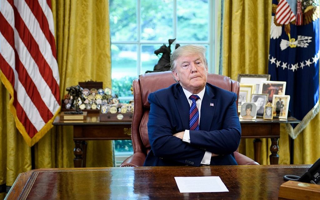 US President Donald Trump pauses while announcing an agreement with Guatemala regarding people seeking asylum in the Oval Office of the White House July 26, 2019, in Washington, DC. (Brendan Smialowski / AFP)