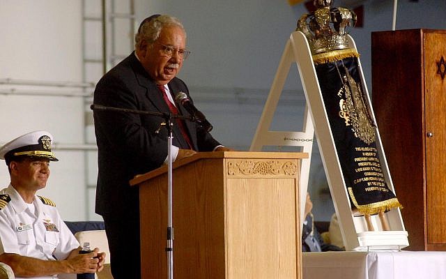 Mark Talisman speaks at a ceremony aboard the USS Harry S. Truman dedicating a Torah scroll, rescued from Lithuania, that was loaned with his help to the Navy vessel, June 24, 2007. (U.S. Navy/Wikimedia Commons via JTA)
