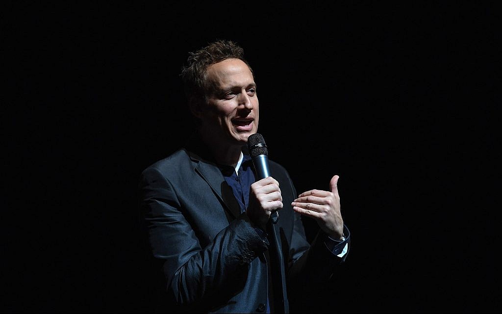 Comedian Elon Gold talks at John Jay College in New York, February 26, 2017. He has incorporated Jew-hatred into his comedy sets for years. (Shahar Azran/Getty Images/via JTA)
