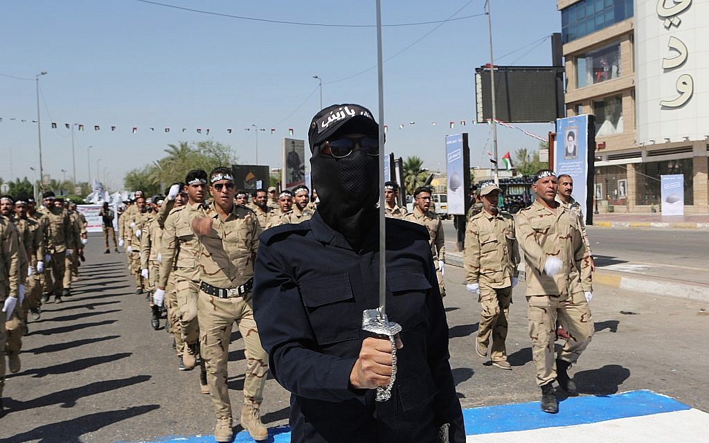 Iraqi Popular Mobilization Forces march in Baghdad, Iraq, May 31, 2019. (Khalid Mohammed/AP)