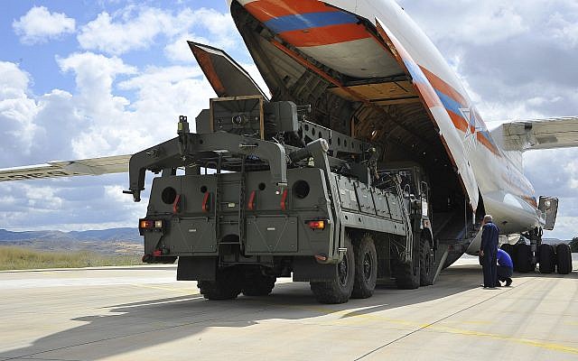 Military vehicles and equipment, parts of the S-400 air defense systems, are unloaded from a Russian transport aircraft at Murted military airport in Ankara, Turkey, July 12, 2019. (Turkish Defense Ministry via AP, Pool)