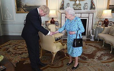 Britain's Queen Elizabeth II welcomes newly elected leader of the Conservative party Boris Johnson during an audience at Buckingham Palace, London, Wednesday July 24, 2019, where she invited him to become Prime Minister and form a new government. (Victoria Jones/Pool via AP)