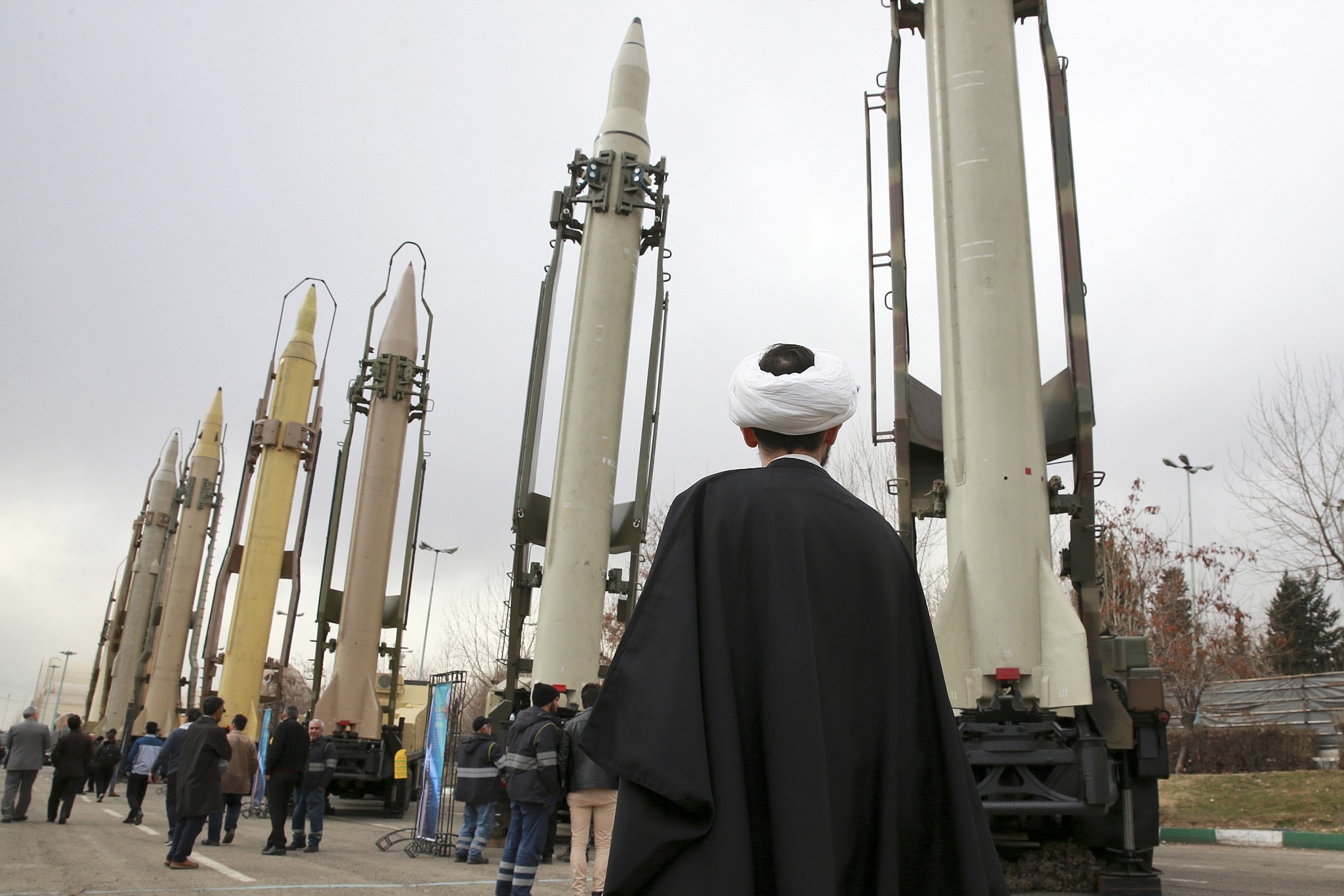 An Iranian clergyman looks at domestically built surface to surface missiles displayed by the Revolutionary Guard in a military show marking the 40th anniversary of the Islamic Revolution, at Imam Khomeini Grand Mosque in Tehran, Iran, February 3, 2019. (Vahid Salemi/AP)
