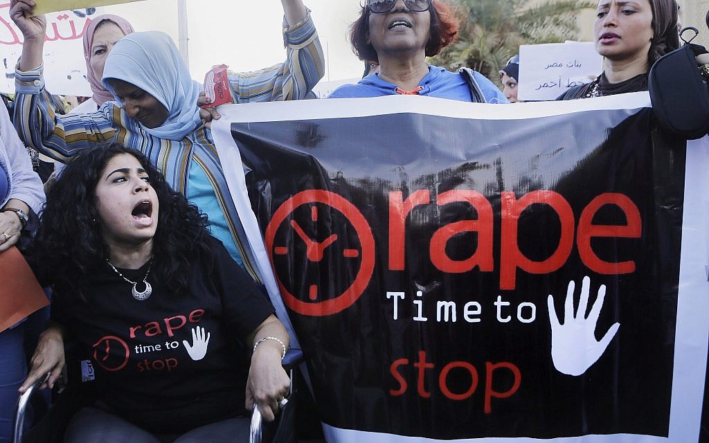 Egyptian women shout slogans and hold banners during a protest against sexual harassment in Cairo, Egypt, Saturday, June 14, 2014. (AP Photo/Amr Nabil)