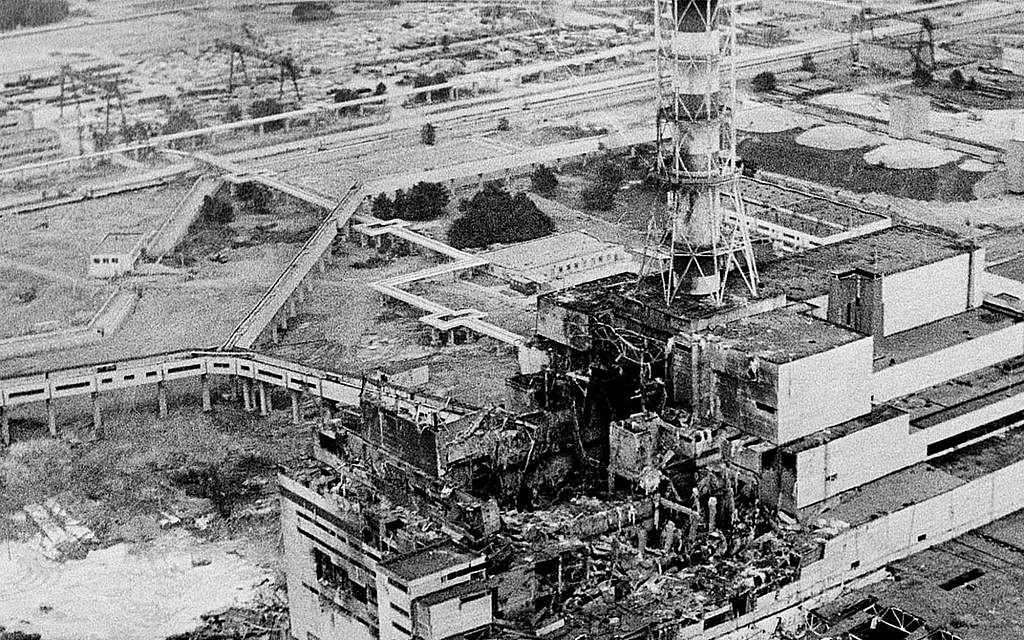 An aerial view of the Chernobyl nuclear power plant, the site of the world's worst nuclear accident, is seen two to three days after the April 26, 1986, explosion. In front of the chimney is the destroyed 4th reactor.   (AP Photo)