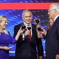 Prime Minister Benjamin Netanyahu, his wife Sara, US ambassador to Israel David Friedman and his wife Tammy at an American Independence Day celebration in Jerusalem, July 2, 2019. (Marc Israel Sellem/Pool)