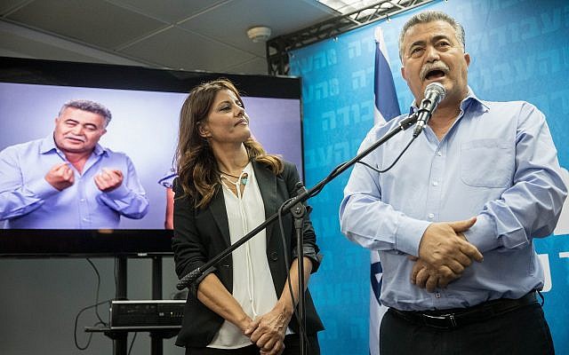 MK Amir Peretz, leader of the Labor party, right, and Orly Levy, head of the Gesher party, seen at an opening event for the new election headquarters in Tel Aviv, on July 24, 2019. (Yonatan Sindel/Flash90)
