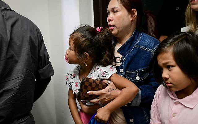 Geraldine Esta and her children Khean and Kathryn arrive for a court hearing in Tel Aviv on July 28, 2019. (Tomer Neuberg/Flash90)