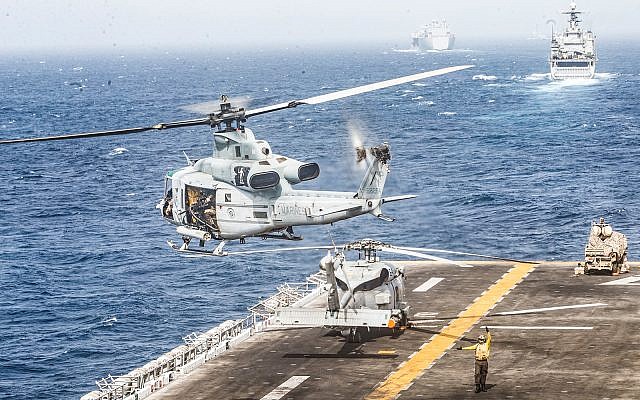 A UH-1Y Venom helicopter takes off from the flight deck of the amphibious assault ship USS Boxer in the Strait of Hormuz, July 18, 2019. (US Marine Corps photo by Lance Cpl. Dalton Swanbeck/Released)