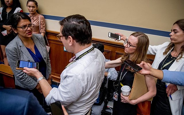Rep. Rashida Tlaib, D-Mich., left, speaks to reporters on Capitol Hill in Washington, July 18, 2019. (AP Photo/Andrew Harnik)