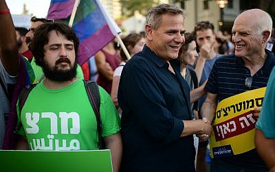 Meretz party chairman Nitzan Horowitz, center, attends a protest of the LGBTQ community in Tel Aviv, July 14, 2019. (Tomer Neuberg/Flash90)