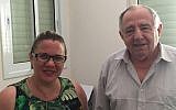 Alexander Kalantyrsky, a construction engineer who helped build the concrete base of the Chernobyl sarcophagus in 1986, at his home in Bat Yam alongside former MK Ksenia Svetlova, June 26, 2019 (ToI staff)