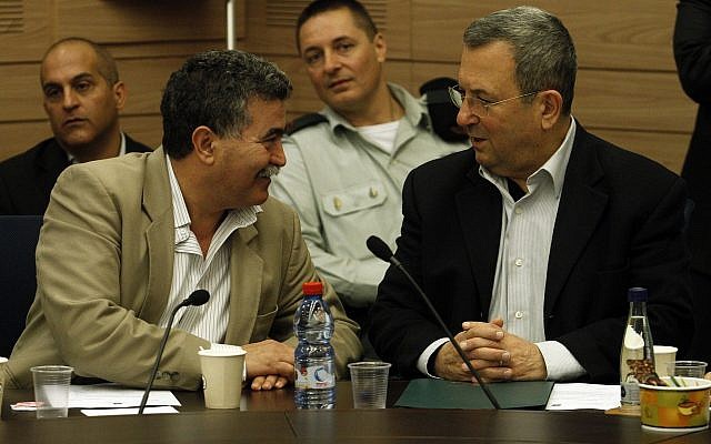 Then defense minister Ehud Barak, right, sits next to MK Amir Peretz as he attends the Foreign Affairs and Defense Committee meeting in the Knesset on March 19, 2012. (Uri Lenz/Flash 90)