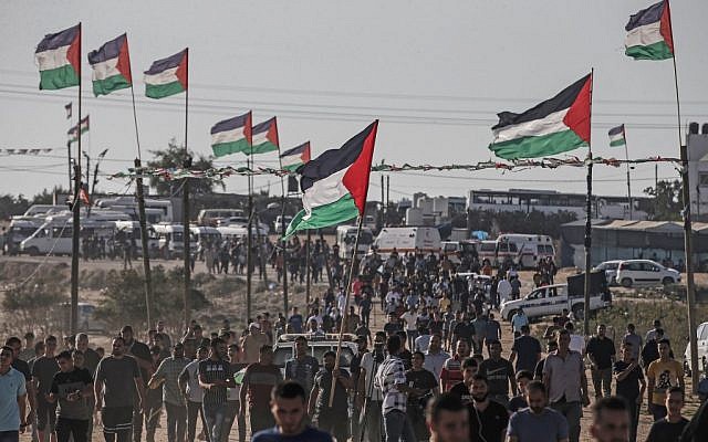 Palestinians demonstrate near the fence along the border with Israel in the eastern Gaza Strip on August 16, 2019. (Mahmud Hams/AFP)