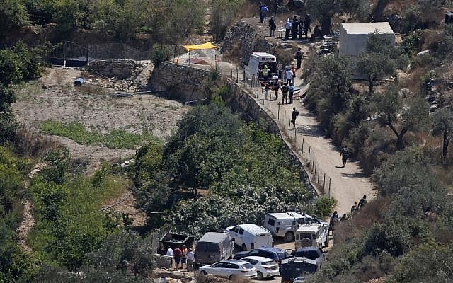 Israeli medical teams and security forces and gather at the site where a bomb exploded in a terror attack near the Israeli settlement of Dolev in the West Bank on August 23, 2019, killing a teenage Israeli girl and seriously injuring her father and brother (Ahmad GHARABLI / AFP)