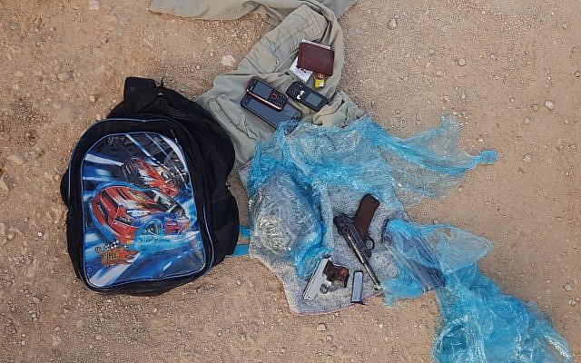 Guns and ammunition found inside a backpack that was being carried into Israel by two Palestinian men from the northern West Bank on August 5, 2019. (Israel Defense Forces)