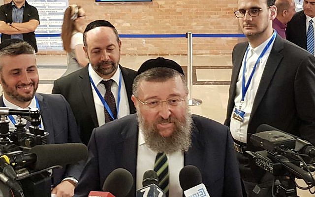 Shas MK Yoav Ben-Tzur speaking to reporters at the Knesset on August 1, 2019, after filing his party forms ahead of the elections. (Raoul Wootliff/Times of Israel)