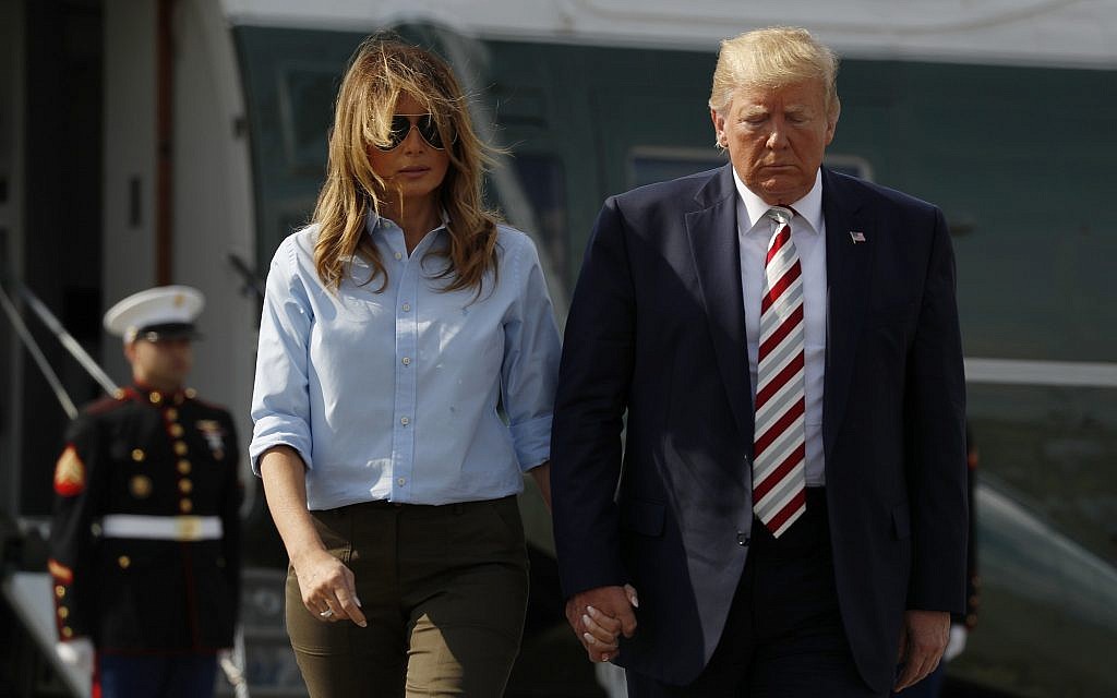 US President Donald Trump, with first lady Melania Trump, walks towards the media before speaking in Morristown, N.J., August 4, 2019. (AP Photo/Jacquelyn Martin)
