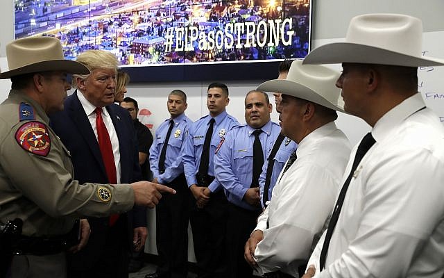 President Donald Trump speaks to first responders as he visits the El Paso Regional Communications Center after meeting with people affected by the El Paso mass shooting, Wednesday, Aug. 7, 2019, in El Paso, Texas. (AP Photo/Evan Vucci)