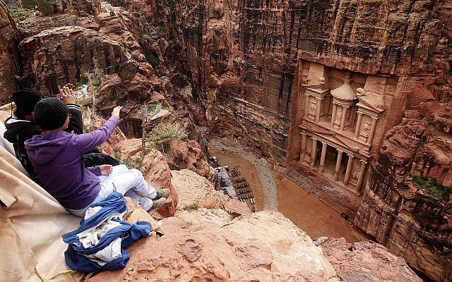 In this photo from February 13, 2017, tourists point at the Treasury, in Jordan's Petra archaeological park. (AP Photo/Sam McNeil, File)