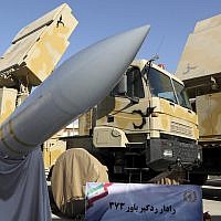 In this photo released by the official website of the office of the Iranian Presidency, the Iran-made Bavar-373 air defense missile system is seen after being unveiled by President Hassan Rouhani, Iran, August 22, 2019. (Iranian Presidency Office via AP)